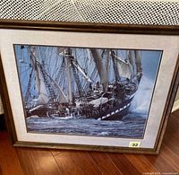 Front view of framed print showing ship and frame