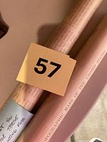 Two rolled maps, one showing 'Topographic Maps of the United States' title