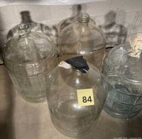Four glass carboys grouped together