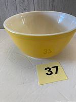 Side view of Pyrex yellow mixing bowl