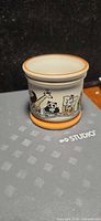 Egg cup front view showing panda and animal graphics