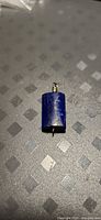 Front view of lapis lazuli rectangular bead pendant showing color and bail