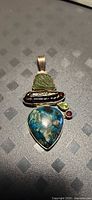 Front view of pendant showing all five gemstones and bail