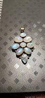 Front view showing ten moonstone cabochons and bail
