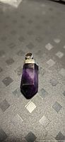 Front view of sterling silver capped purple fluorite pendant