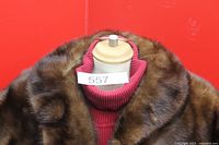 Front view of brown fur shawl on mannequin