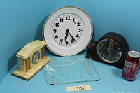 Group shot showing all three clocks, glass face and size reference