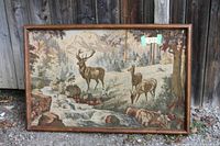Front view of framed deer tapestry showing full scene and frame