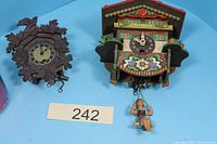 Both miniature cuckoo clocks side by side