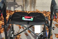 Top view showing padded split seat and brake handles