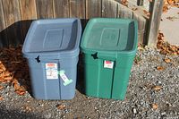 Blue and green Rubbermaid totes with lids closed, exterior view