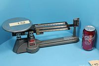 Full view of Ohaus triple beam balance with pan and beams