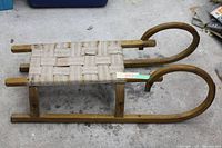 Side view showing full sleigh, wood frame and woven seat