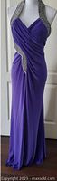 Full front view of purple halter dress on mannequin