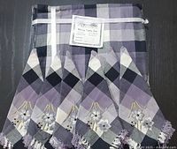 Packaged Romanita dining table set showing tablecloth and napkins