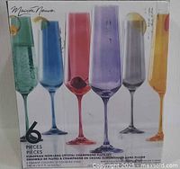 Front of retail box showing six coloured crystal flutes and capacity