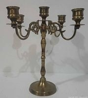 Front view of brass five-arm candelabra