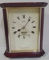 Front view of Seiko mantel clock showing dial and case