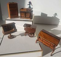 Group shot of five miniature wood furniture pieces
