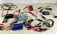 Overview of all chargers, inverters, multimeter, adapters, clamp cables