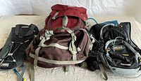 Front view of Kelty backpack, CamelBak Classic pack, CamelBak M.U.L.E. pack and additional bag