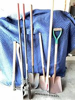 Group shot showing all seven tools upright against blanket