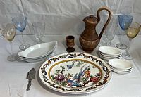 Group shot of all serveware, glasses, pitcher and utensils