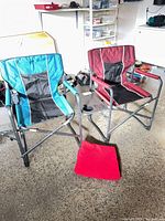 Both folding director chairs side by side showing colors and frame
