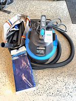 Shop vacuum with hose, accessory bag, filter