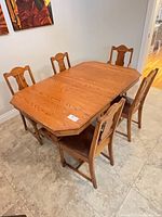 dining table with five chairs around