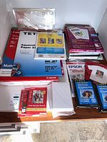 Overview of multiple photo paper packs on table