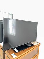 Front view of Samsung 39-inch TV on stand