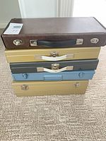 Stacked view of all five slide cases showing exterior finishes and hardware