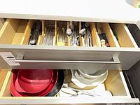 Drawer view showing cutlery and bowls