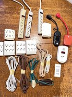 Group of all power strips, wall taps, cords and small devices