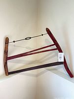 Full view of buck saw leaning in corner