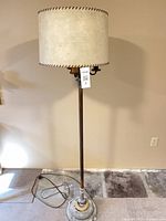 Full view of floor lamp with fabric drum shade