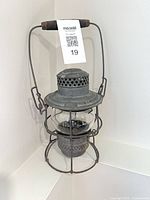 Full view of lantern with handle raised