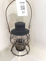 Front view showing full lantern with bail handle and tag