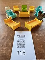 All seven Fisher-Price Little People accessories arranged together