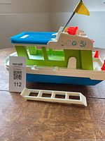 Starboard view showing hull, cabin, gangplank ladder and flag