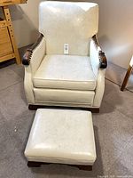 Front view of chair with footstool