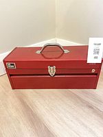 Closed red My Buddy toolbox with handle and latch