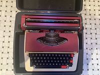 Open Majestic 1200 electric typewriter inside carry case, top view
