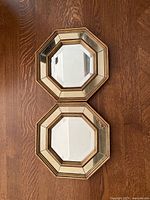 Front view of both octagonal mirrors showing mirrored frames and glass surfaces