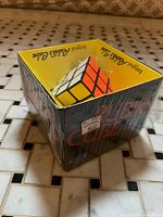 Shrink-wrapped Rubik’s Cube in display box with Eaton’s price tag visible