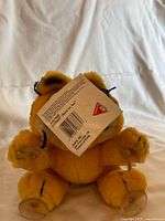 Rear view of Garfield plush showing barcode tag and suction cups