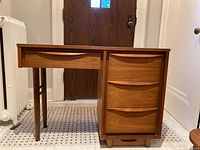 Front and right side view showing drawer configuration and leg design