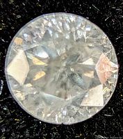 Front view of loose round diamond on black background