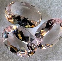 Three views of the faceted morganite stone showing clarity and color